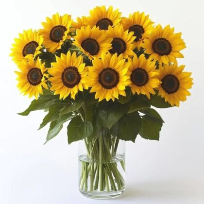A vibrant Classic Sunshine Yellow Sunflower Bouquet arranged with fresh greenery in a decorative wrap.