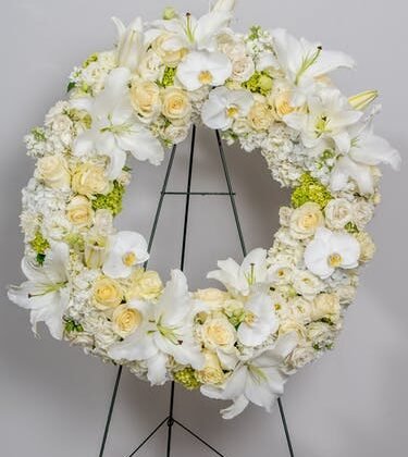 White Orchid And lily Tribute Wreath | White Tribute Wreath | lily Tribute Wreath | Orchid And lily Tribute Wreath | Online flower company