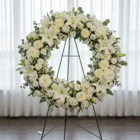 Ethereal White Orchid & Lily Funeral Wreath on Stand
