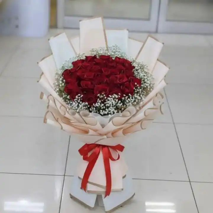 Luxury 18 Red Roses Romance Bouquet 1 A stunning 18 roses bouquet of fresh red blooms elegantly arranged for a romantic surprise.