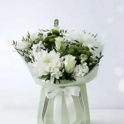 Handcrafted white chrysanthemum bouquet mixed with elegant roses in a classic floral arrangement.