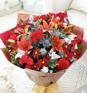 Orange Lily and Red Carnation Bouquet featuring vibrant orange lilies and rich red carnations for a stunning floral arrangement.