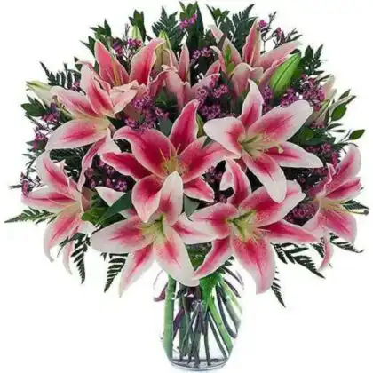 A hand-tied pink stargazer lily bouquet with blooming petals and green foliage in a decorative wrap.