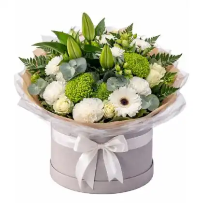 A stunning gerbera daisy and calla lily bouquet arranged with fresh greenery for an elegant floral display.