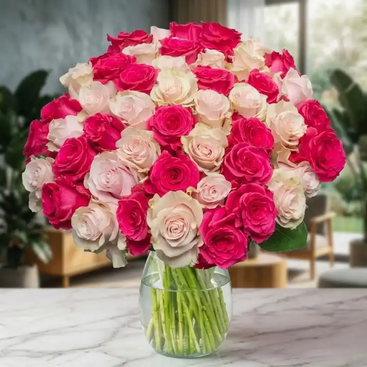 The Serenity Bouquet: Pink & White Roses 1 A hand-tied white and pink roses bouquet accented with lush green foliage in a soft paper wrap.