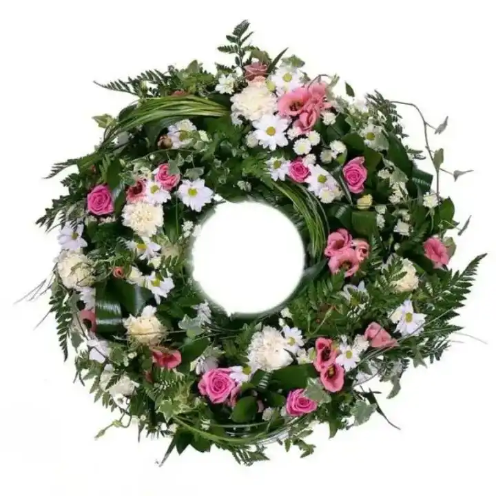 Classic Pink & White Serenity Funeral Wreath 1 A lush green funeral wreath elegantly arranged with serene pink and white roses to honor a loved one's memory.