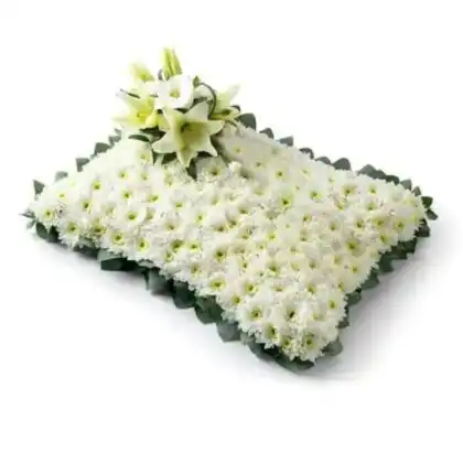 Serene Pillow Funeral Flowers arrangement handcrafted with fresh white lilies and white chrysanthemums for a memorial service.