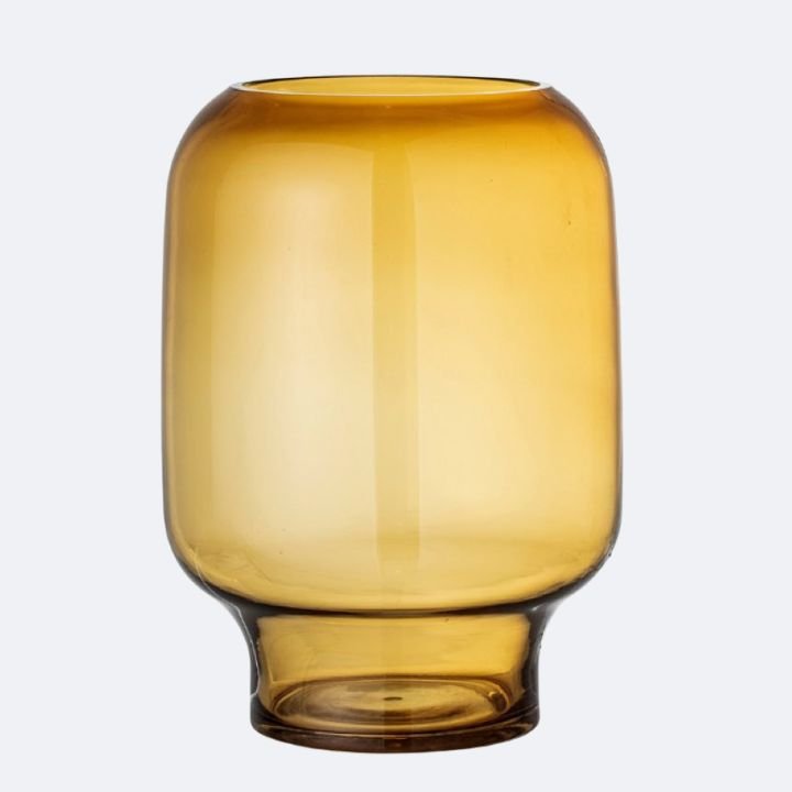 Bloomingville Adine Amber Glass Vase 1 A rounded Bloomingville Adine amber glass vase with a narrow base, perfect for warm-toned home styling and floral displays.