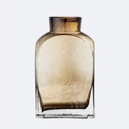 A textured Bloomingville Denver Brown Glass Vase with an amber finish and a sturdy rectangular base for home decoration.
