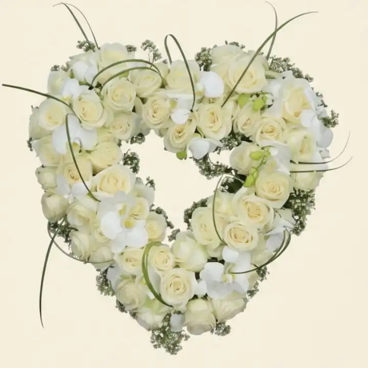 The Eternal Love Heart: A Premium Tribute in Cream and White 1 Handcrafted open heart funeral flowers with cream roses and white orchids on a leaf base.