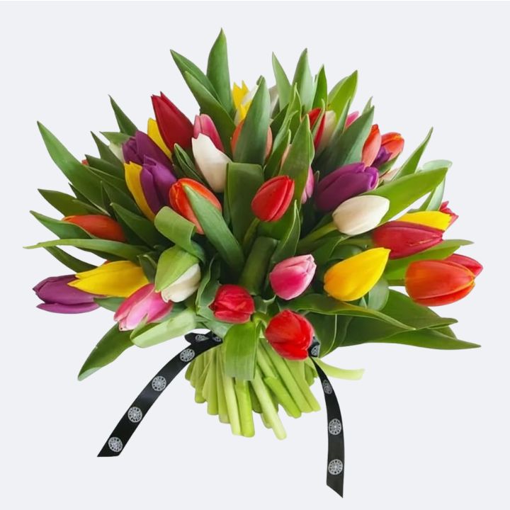 Vibrant Mixed Tulips Hand-Tied Bouquet 1 A vibrant mixed tulips bouquet featuring red, yellow, pink, and purple flowers hand-tied with a black patterned ribbon.