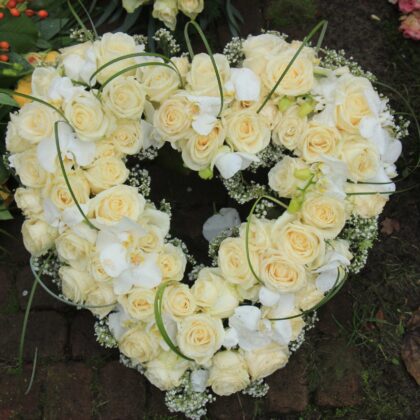 Floral Heart Wreath Funeral. Funeral Flower Delivery: Express Sympathy with Grace and Care