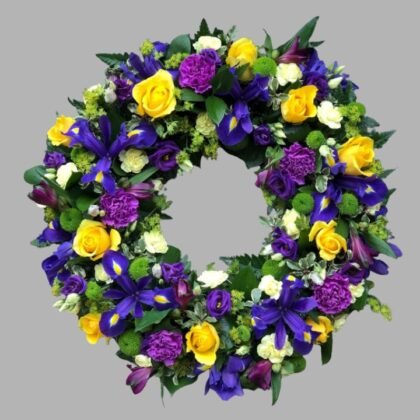 Elegant Yellow and Blue Wreath for a funeral, featuring vibrant yellow roses and soft blue hydrangeas, symbolizing lasting compassion.