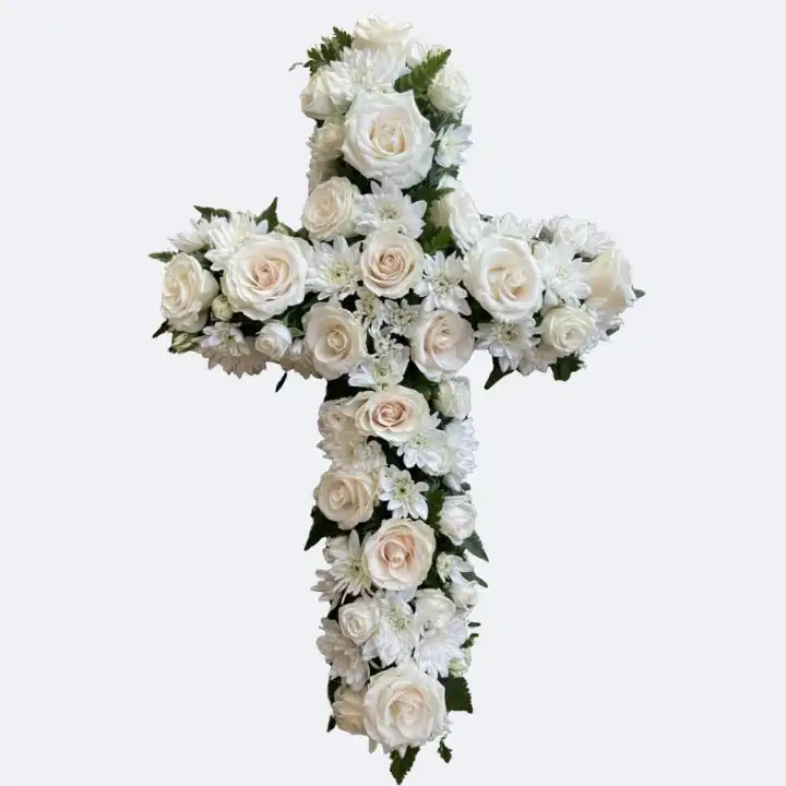 White Rose & Chrysanthemum Funeral Cross 1 A handcrafted funeral cross flowers arrangement featuring fresh white roses and chrysanthemums on a woven background.