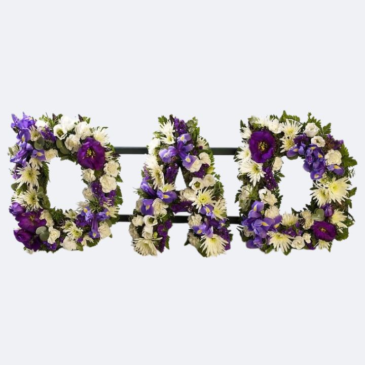 Personalized Dad Funeral Floral Tribute 1 Fresh purple and white floral letters spelling DAD as a meaningful Dad Funeral Tribute for memorial services.