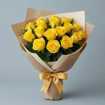A hand-tied 12 yellow rose bouquet featuring fresh sunny blooms and elegant green foliage.