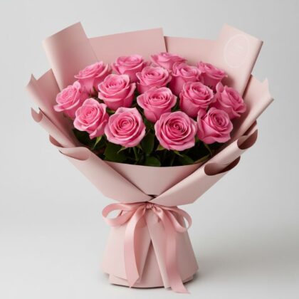 A lush 24 pink roses bouquet wrapped in soft pink paper with a decorative satin ribbon.