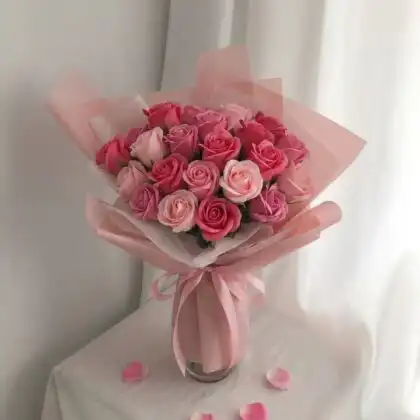 A luxury dome style pink rose flower bouquet arranged with fresh petals and elegant greenery.