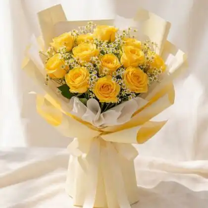 A luxury yellow rose bouquet arranged with delicate white gypsophila in a premium floral wrap.