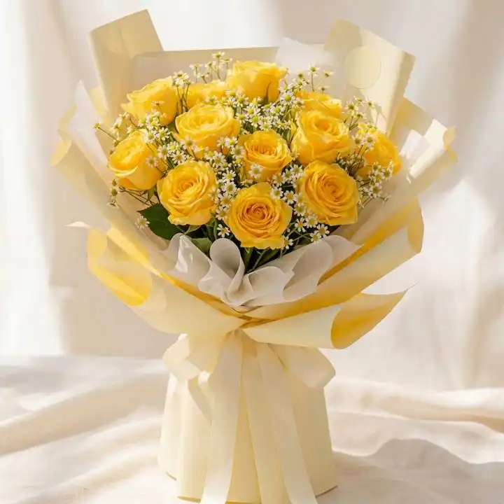Yellow Rose & Gypsophila Bouquet 1 A luxury yellow rose bouquet arranged with delicate white gypsophila in a premium floral wrap.