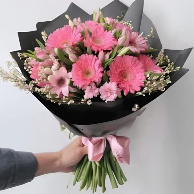 Pink Spring Flower Bouquet Mother's Day Gift held by a man in hand