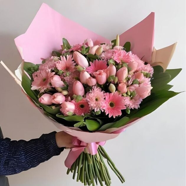 Pink Spring Flower Bouquet Mother's Day Gift held in a man's hand