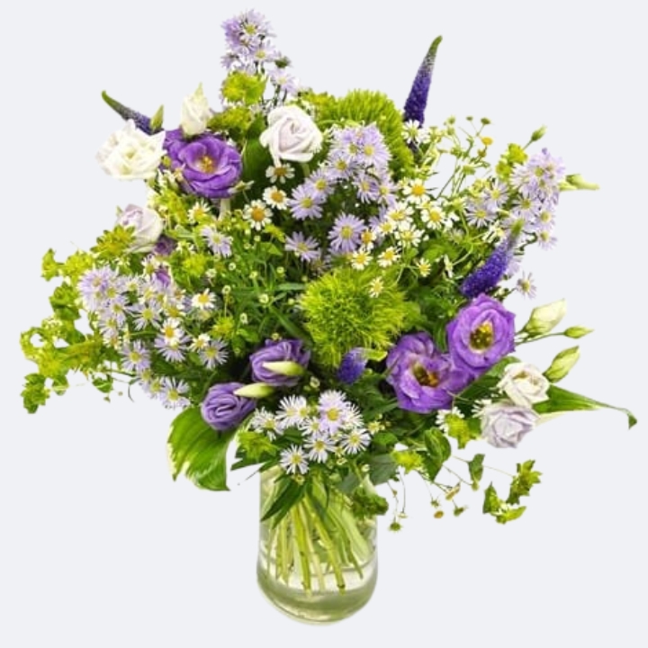Midnight Meadow Aster & White Rose Hand-Tied Bouquet 1 Vibrant aster and rose bouquet featuring purple lisianthus and chamomile daisies in a clear glass vase.