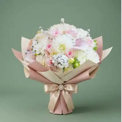 A vibrant dahlia and rose bouquet elegantly arranged with fresh greenery for a luxury aesthetic.