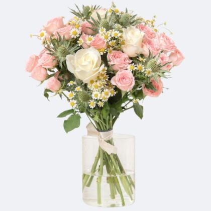 A beautiful daisy and rose bouquet arranged with fresh greenery in a stylish wrap.