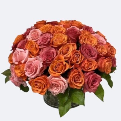 A hand-tied orange and pink rose bouquet wrapped in decorative paper, showcasing vibrant blossoms and fresh greenery.