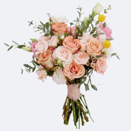 A handcrafted Lisianthus and Rose Bouquet featuring soft pastel petals and lush greenery in a decorative wrap.