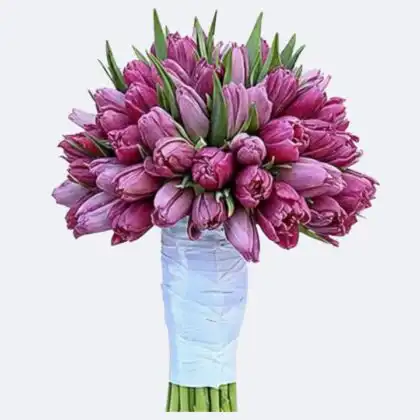 A handcrafted Lisianthus and Rose Bouquet featuring soft pastel petals and lush greenery in a decorative wrap.