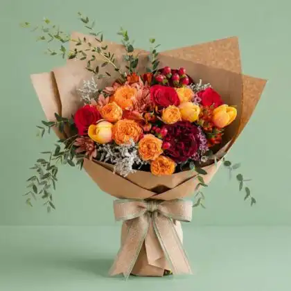Handcrafted Sunset Velvet luxury chrysanthemum and tulip bouquet arranged in a premium floral wrap for gifting.