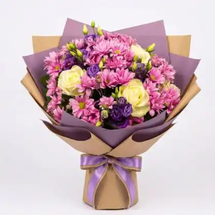A hand-tied chrysanthemums flower bouquet featuring soft pink blooms paired with elegant white roses in a stylish wrap.