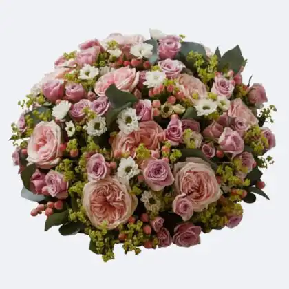 Beautiful and elegant funeral posy flowers arrangement in shades of soft pink roses, small purple accents, and white spray chrysanthemums for a heartfelt tribute.