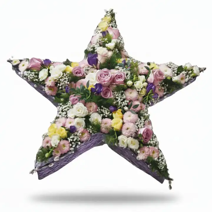 Rose and Carnation Star Floral Tribute 1 Elegant star funeral flowers arrangement featuring light pink roses, white carnations, and lilac accents, designed as a beautiful sympathy tribute.