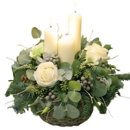 Elegant Christmas White Candle Arrangement featuring tall pillars, silver accents, and winter greenery on a table.
