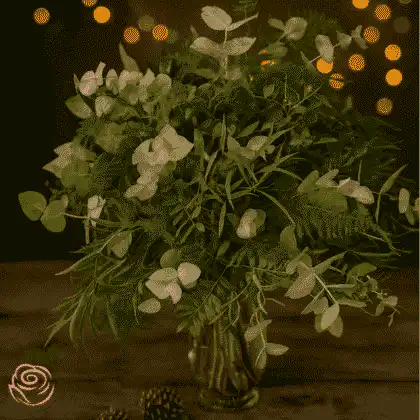 Elegant green cut foliage vases featuring assorted greenery, perfect for Christmas décor and festive table displays