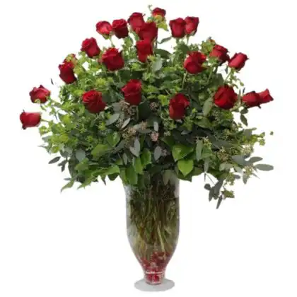 A stunning, tall glass vase holding a voluminous bouquet of bright red roses and lush green foliage, categorized as Large Christmas flower arrangements. Christmas Rose Flower Delivery With Big Vase for sale