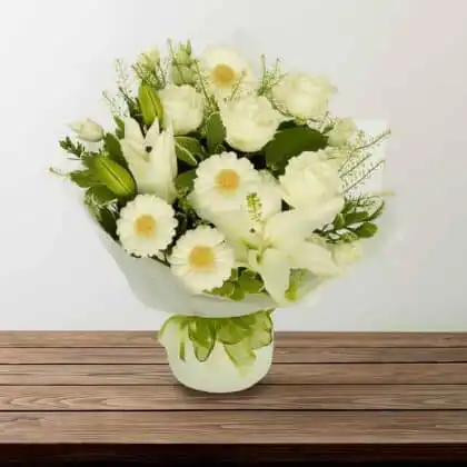 White roses and lilies hand-tied bouquet.