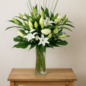 Elegant White Lilies in a Vase with Fresh Hydrangeas